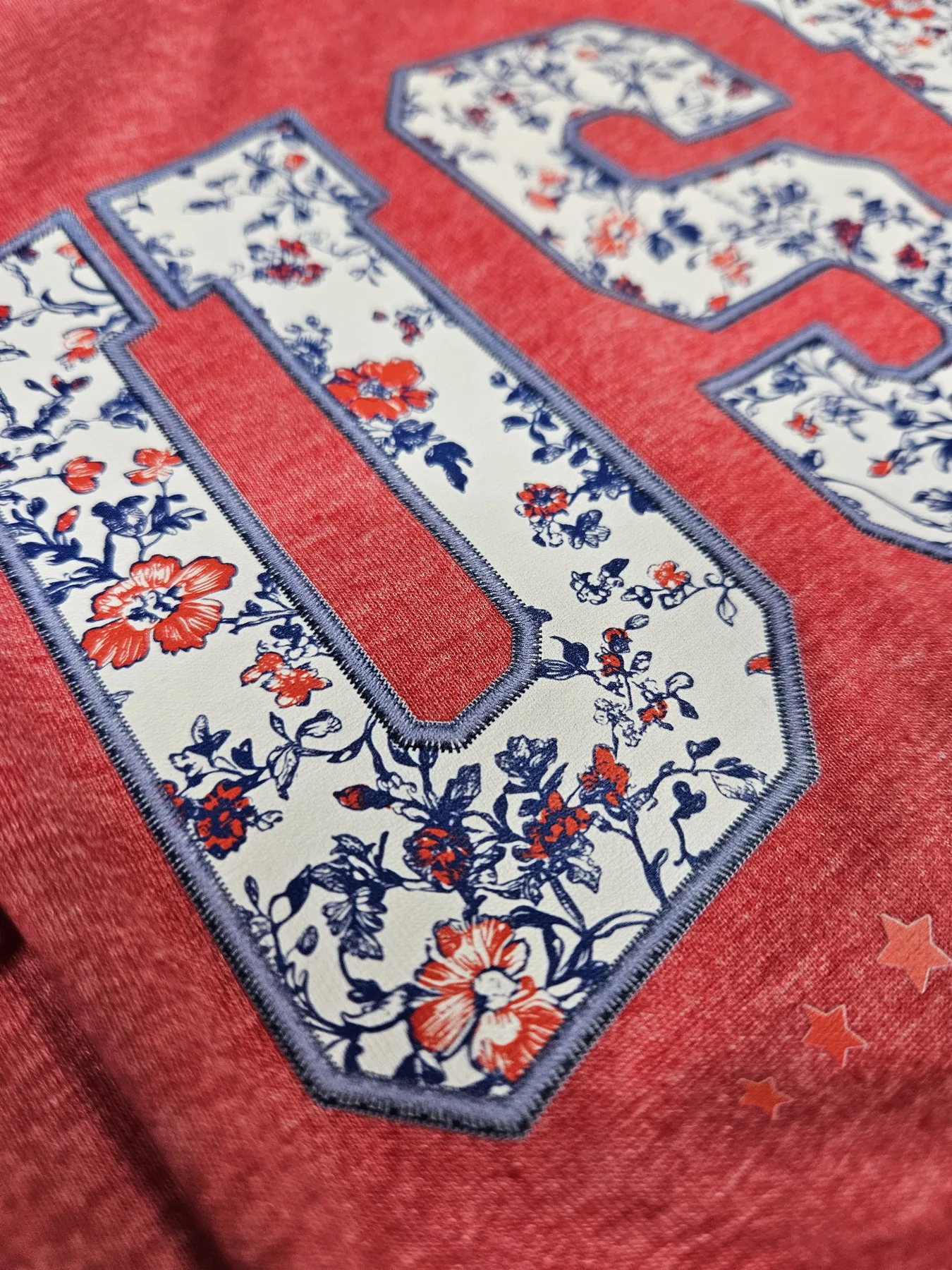 Custom floral number print on a red shirt